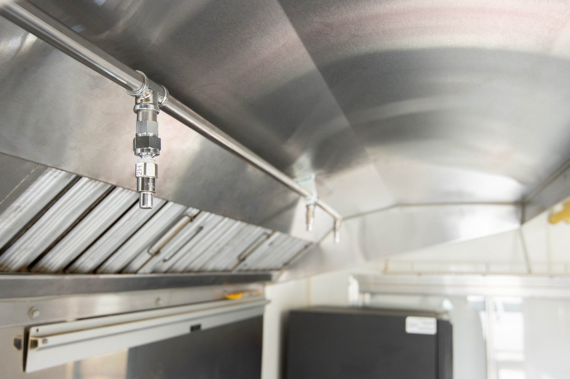 Hood suppression system nozzles that are connected to a ProTex II system tank