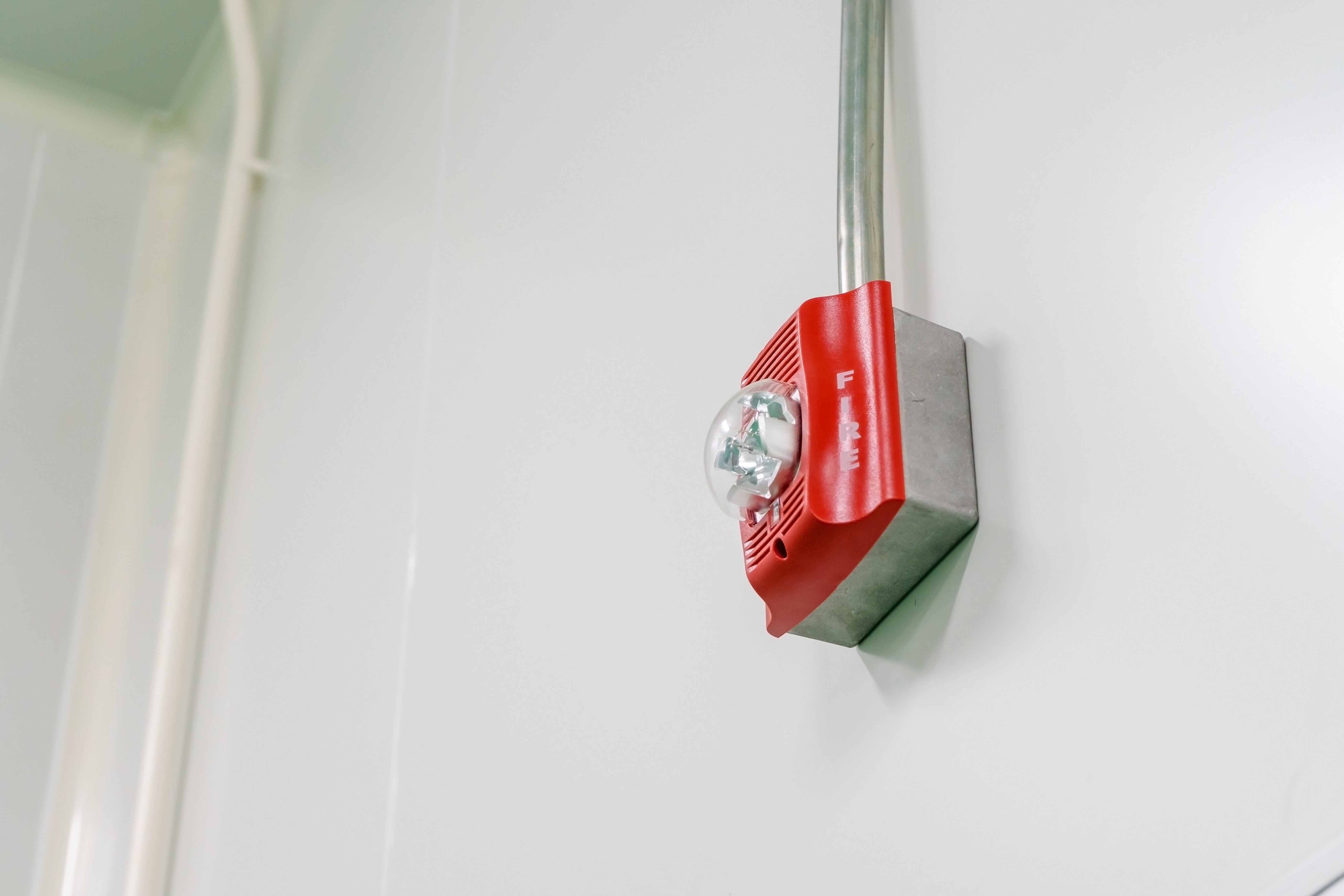 Fire alarm system wired into a building by a technician for emergency events 