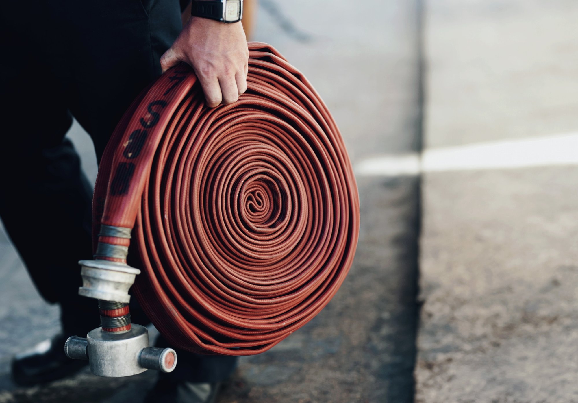person-outdoor-hand-with-fire-hose-service-emergency-first-responder-street-firefighter-volunteer-hosepipe-coil-safety-fireman-ready-fearless-career-danger