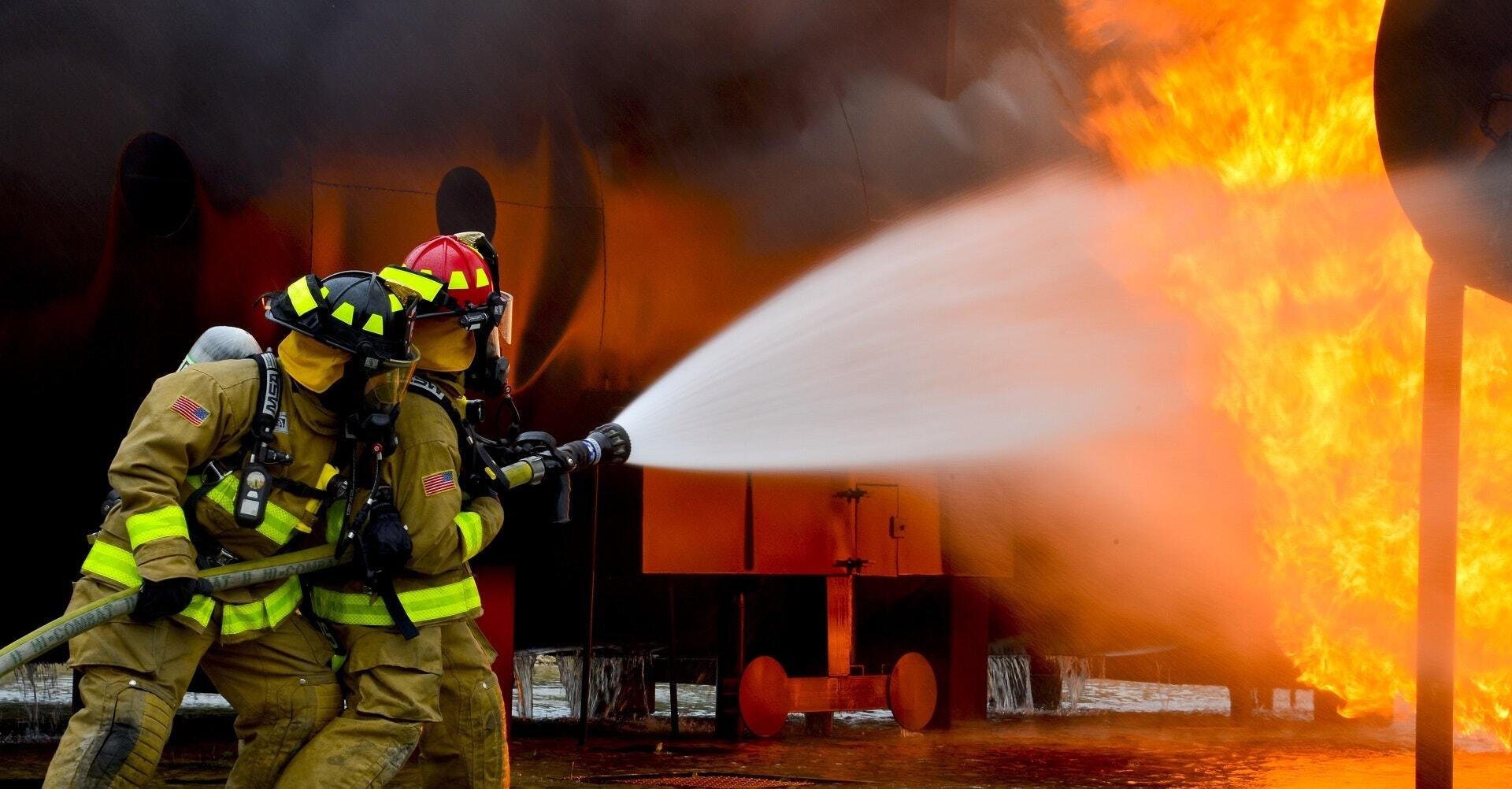 Firefighters Using Hose with high quality parts under pressure and high heat